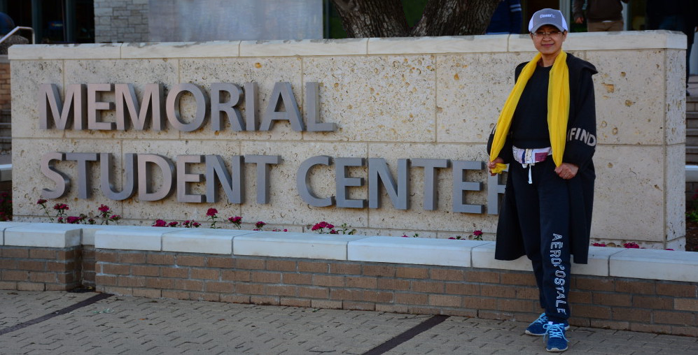 Ling Wang in front of the Memorial Student Center